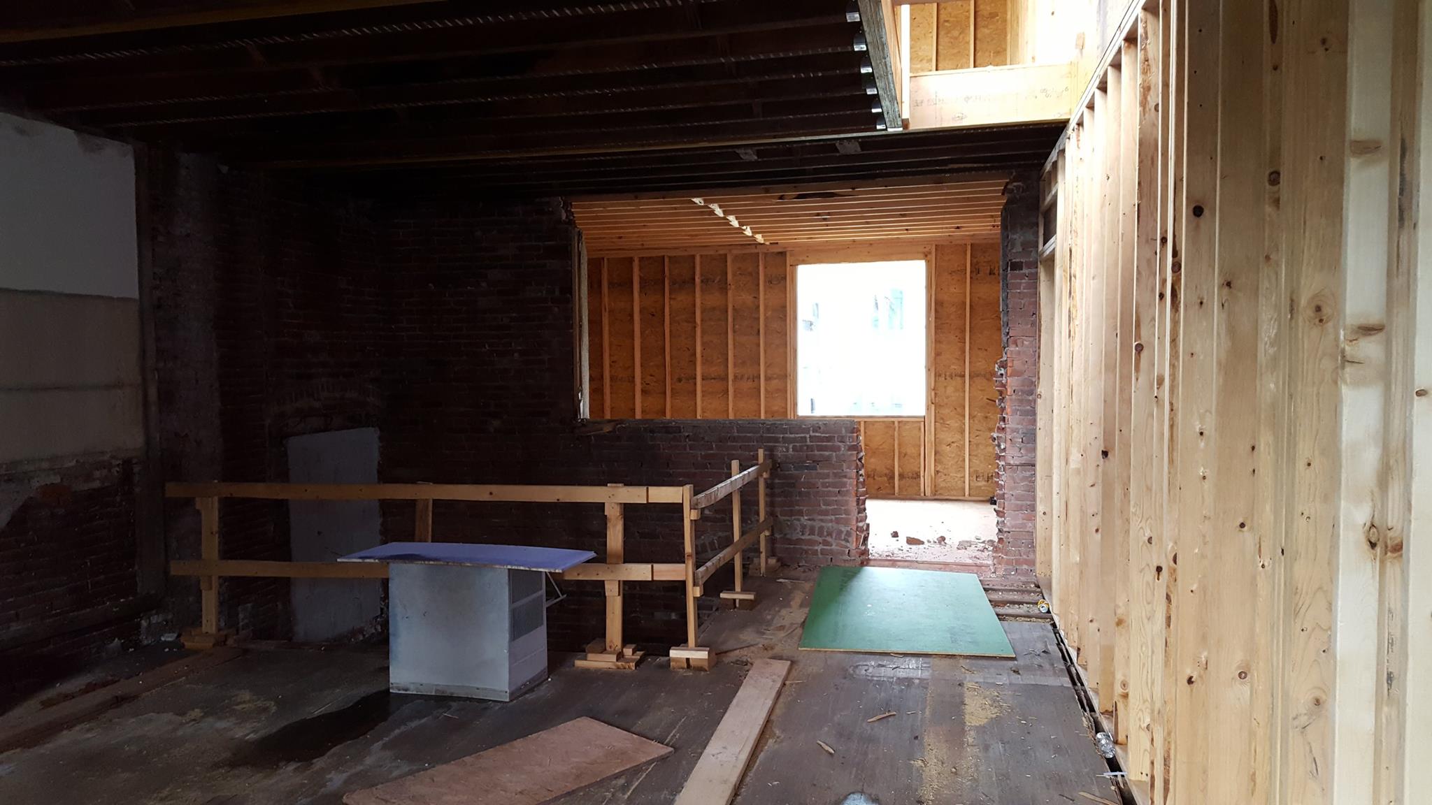 New openings were cut in the original back wall. This doorway accesses an addition at the second floor that contains a bedroom.