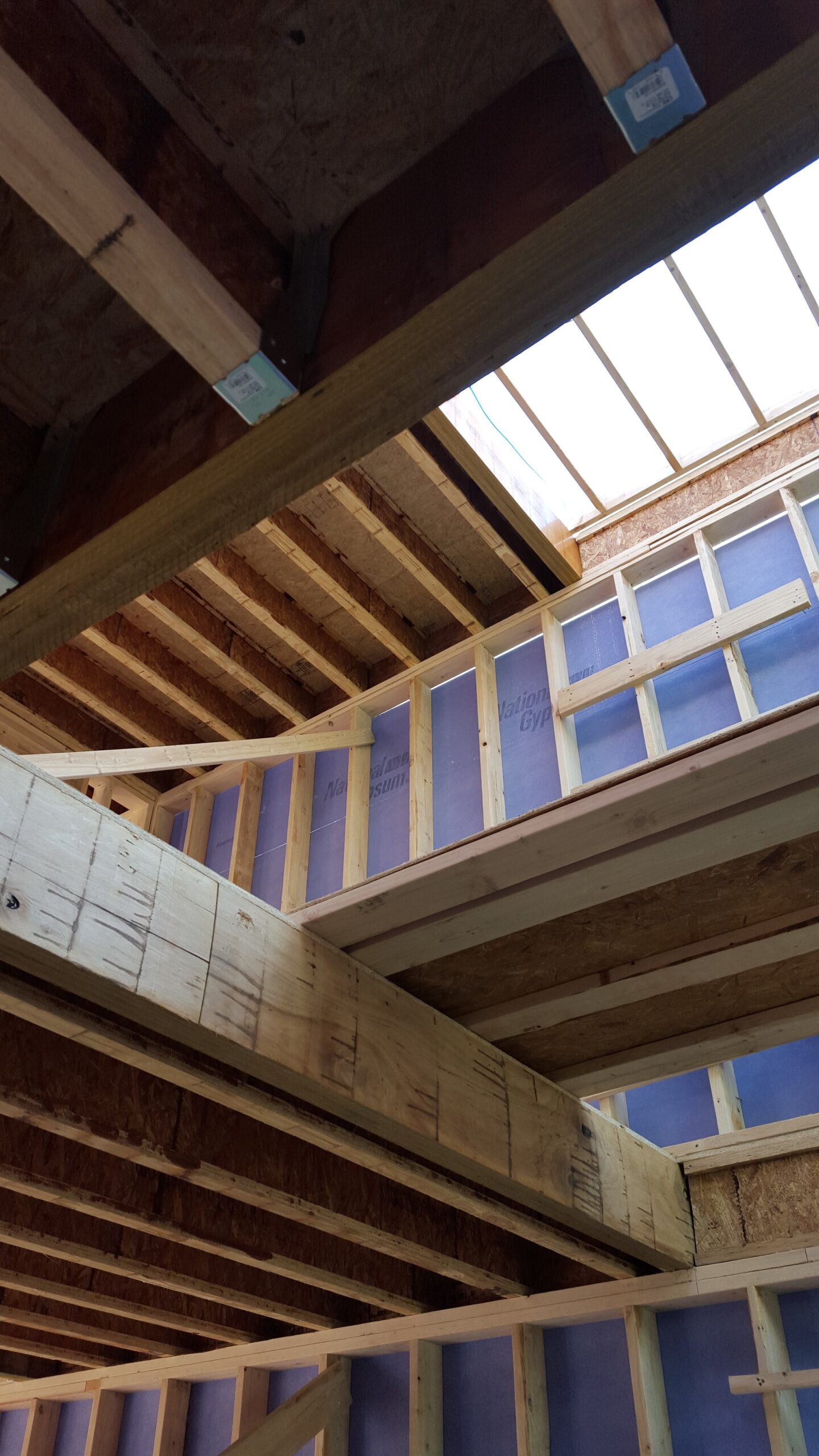 interior view of framing; because of the width of the house, we needed to use wood I joists for the floors and roof