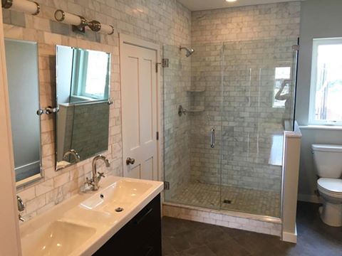 large master bath with double vanity and walk in shower