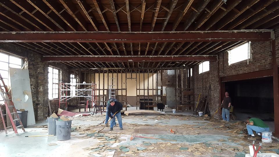 the former main hall; the walls between the new homes will fall along the beam lines